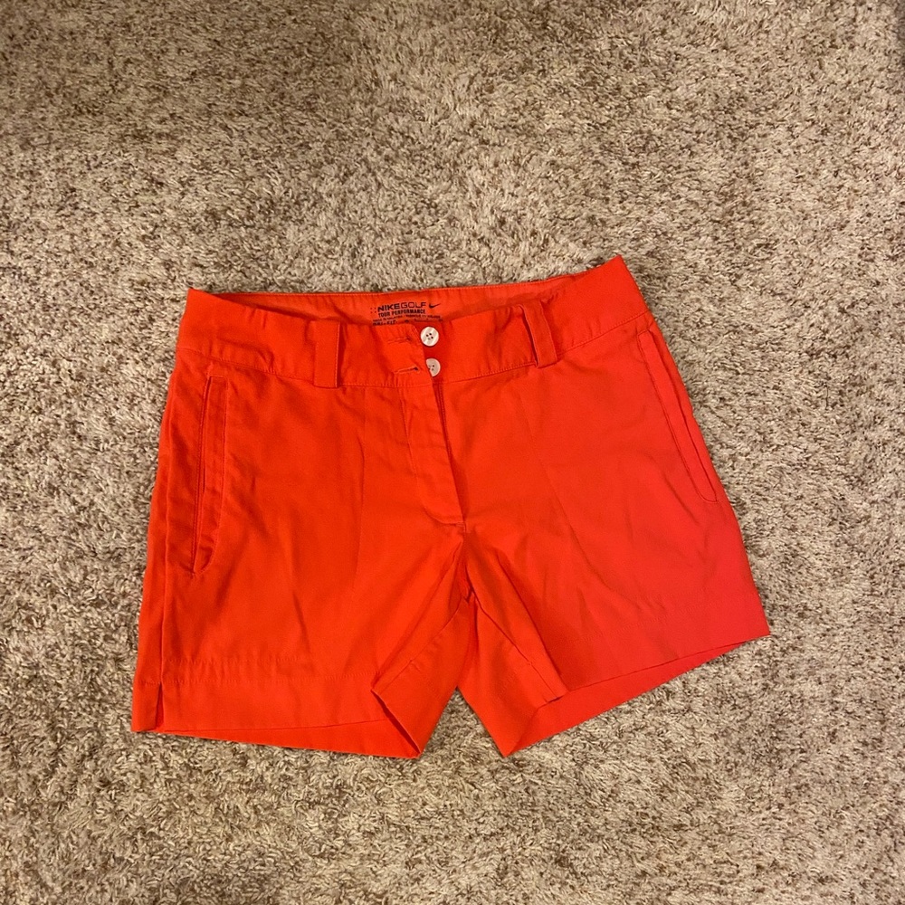 Size 4 coral/bright red Nike golf shorts